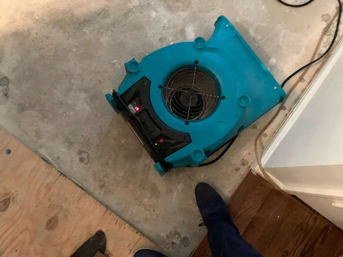 Air mover drying subfloor during Commercial Water Damage Restoration in Hickory Hills